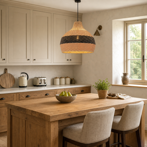 black rattan pendant light beside a bright window