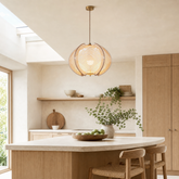 wood pendant light in a sunlit breakfast nook