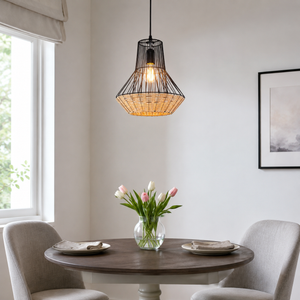 rattan iron pendant light above a bright dining table