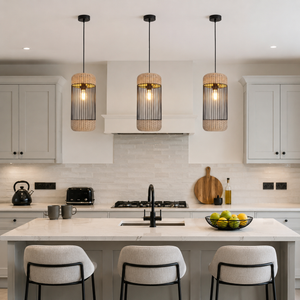 rattan iron cylinder pendant light beside a bright window