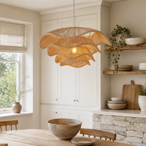 Layered rattan pendant above a warm kitchen counter