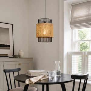 black rattan pendant light in a sunlit breakfast nook