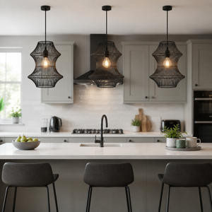 black rattan iron pendant light beside a bright window