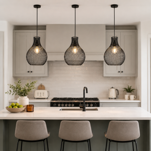 black iron pendant light in a sunlit breakfast nook