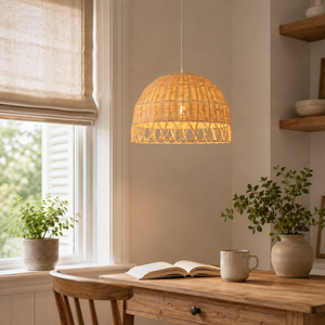 rattan globe pendant light beside a bright window