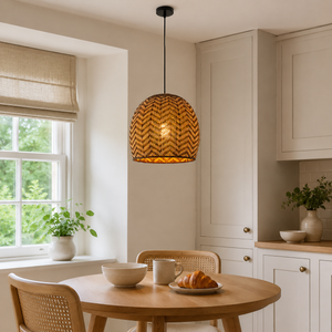 rattan wave-detail pendant light over a warm kitchen counter