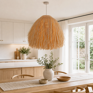 Fringed straw rattan pendant above a warm kitchen counter