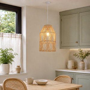 rattan pendant light over a warm kitchen counter