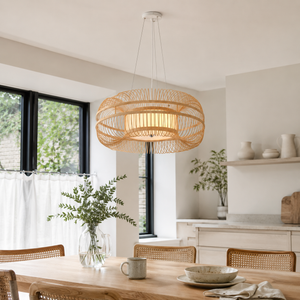 Layered bamboo drum pendant over a bright kitchen counter