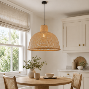 Bamboo dome pendant light above a bright round dining table