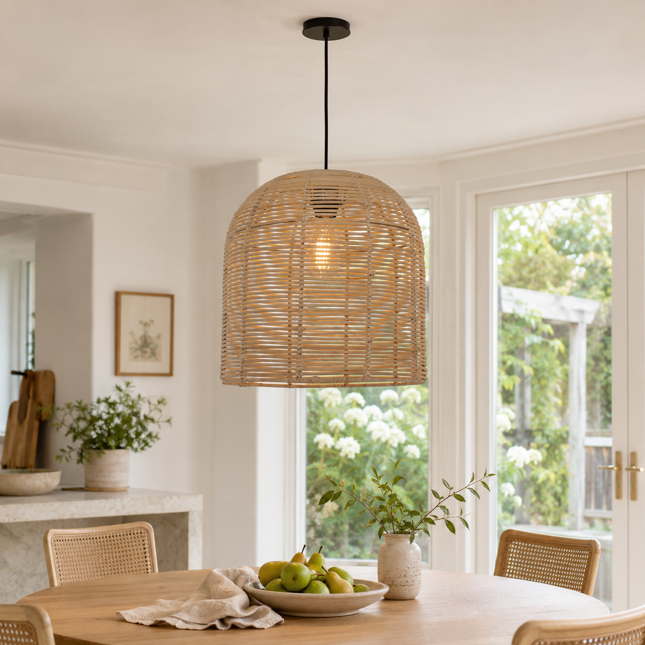 Handwoven rattan ceiling pendant above a kitchen counter