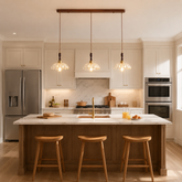 3-light walnut resin mini pendant light above a bright kitchen island