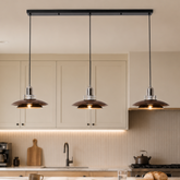 3-light walnut iron pendant light set of three walnut iron pendants over a kitchen counter