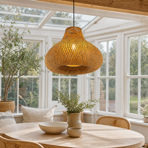 Handwoven bamboo gourd pendant in a bright garden room