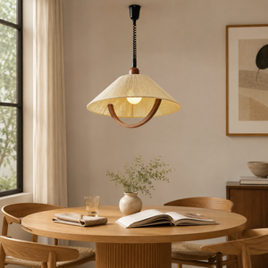 natural wood curved pendant light above a round dining table