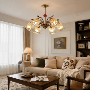 6-light gold vintage pink floral glass chandelier above a living room coffee table