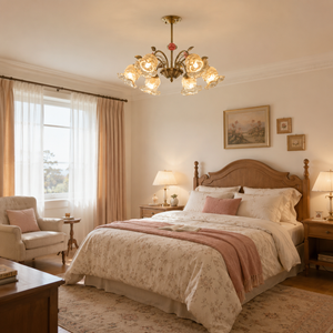 6-light gold vintage pink floral glass chandelier in a warm bedroom setting
