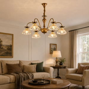 6-light gold vintage floral glass chandelier above a living room sofa