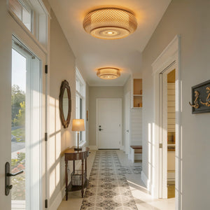 two rattan ceiling lights down a bright hallway