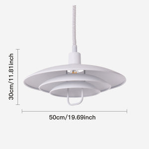white layered minimalist pendant light beside a cosy seating area