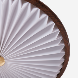 walnut pleated flush ceiling light in a soft neutral room setting