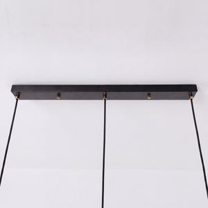 3-light walnut wood mini pendant beside a cosy seating area