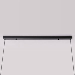 3-light walnut iron bar pendant beside a cosy seating area