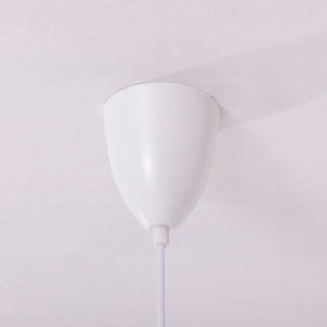 blue layered minimalist pendant light beside a cosy seating area
