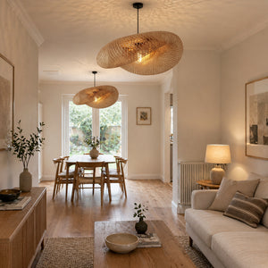 two bamboo pendant lights connecting open-plan living and dining space