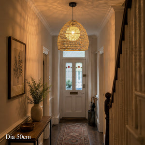 50cm rattan pendant light with inner sphere glowing in a hallway