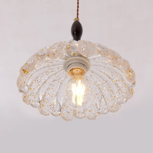 3-light walnut resin mini pendant over a kitchen island