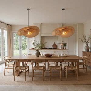 twin bamboo pendant lights over a long wooden dining table