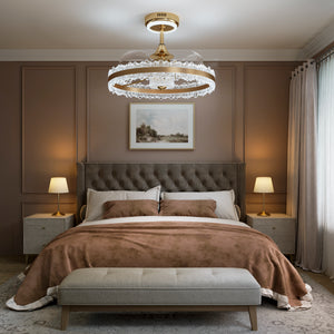 Gold halo ceiling fan light in cool white above a modern bedroom
