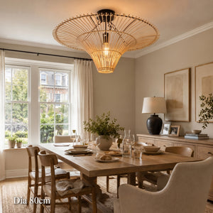 80cm rattan saucer ceiling light above a bright dining table and chairs