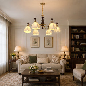 6-light chandelier with yellow fabric shades with close-up glass flower detail