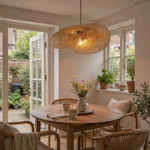 woven bamboo pendant light above a cosy round dining table
