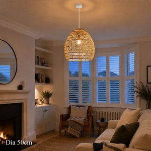 50cm rattan pendant light without inner sphere by a fireplace lounge