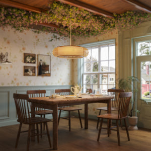 rattan pendant light over a farmhouse dining table
