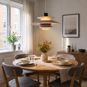 white layered minimalist pendant light styled in a calm bedroom