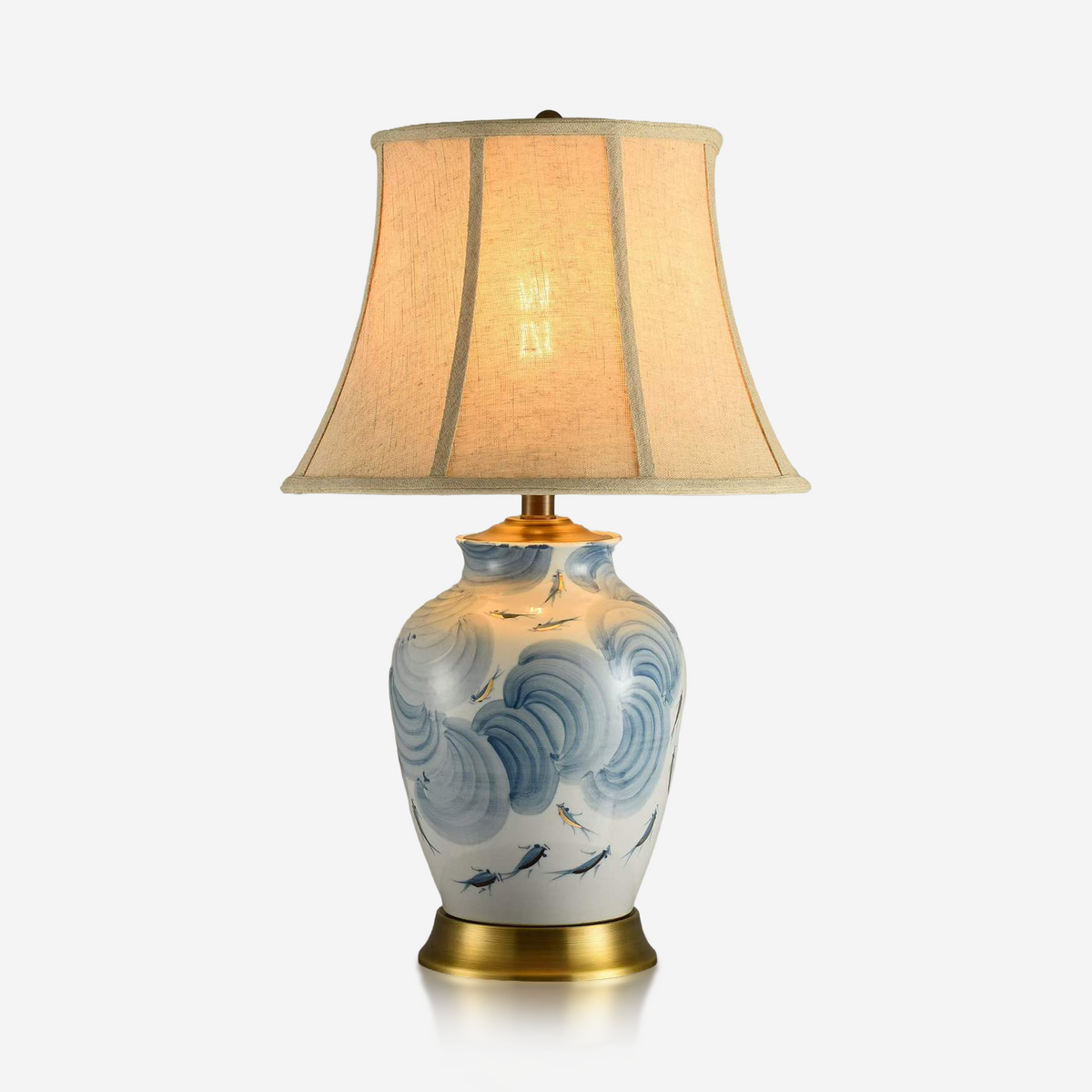 Blue and white pond fish ceramic table lamp with ivory fabric shade