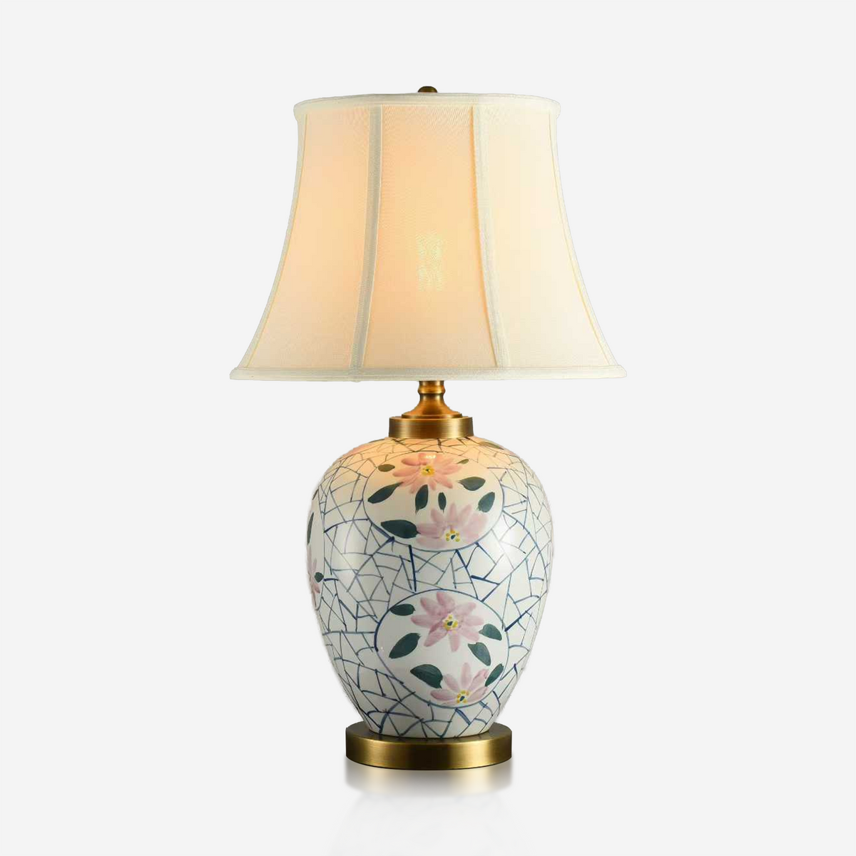White ceramic table lamp painted with pink lotus flowers and green leaves