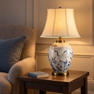 Glowing blue crane lamp on a wooden side table beside an armchair