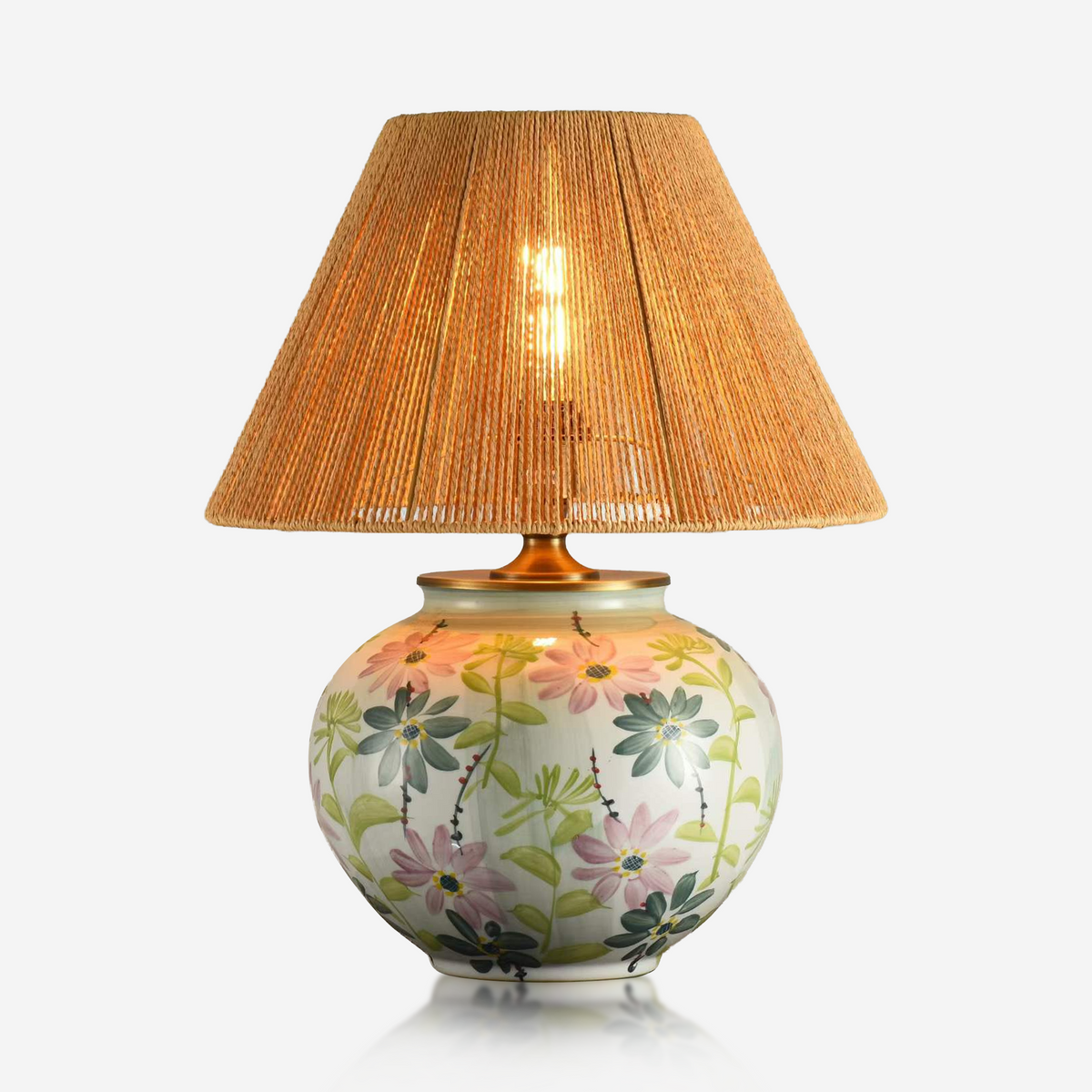 Round floral ceramic table lamp with natural woven shade and painted flowers