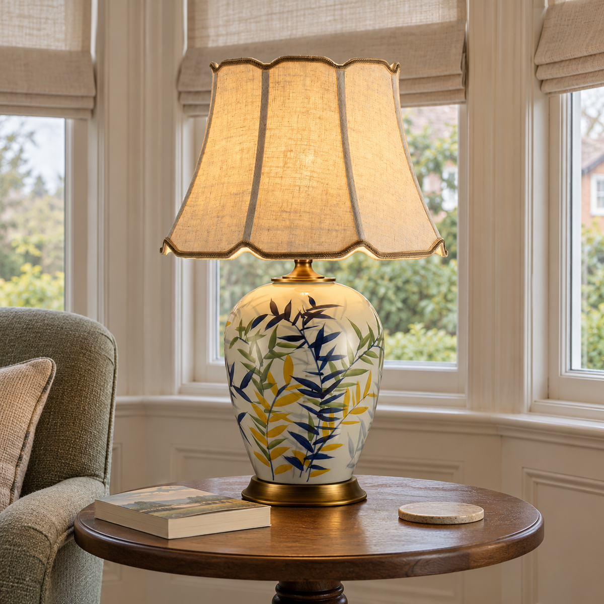 Colourful leaf-pattern ceramic lamp with scalloped shade on a living room side table