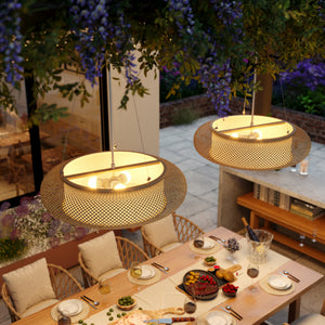 overhead bamboo pendant lights on an outdoor dining table