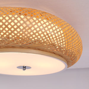 close-up of ceiling light diffuser and woven rattan shade