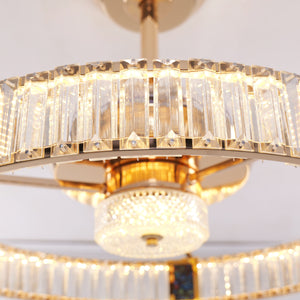 Gold crystal ceiling fan light detail showing decorative frame and fan blades