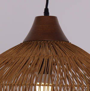 Natural rattan ceiling lamp hanging over dining table
