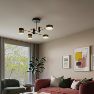 Modern living room with a red sofa, round marble table, and abstract art on the wall.