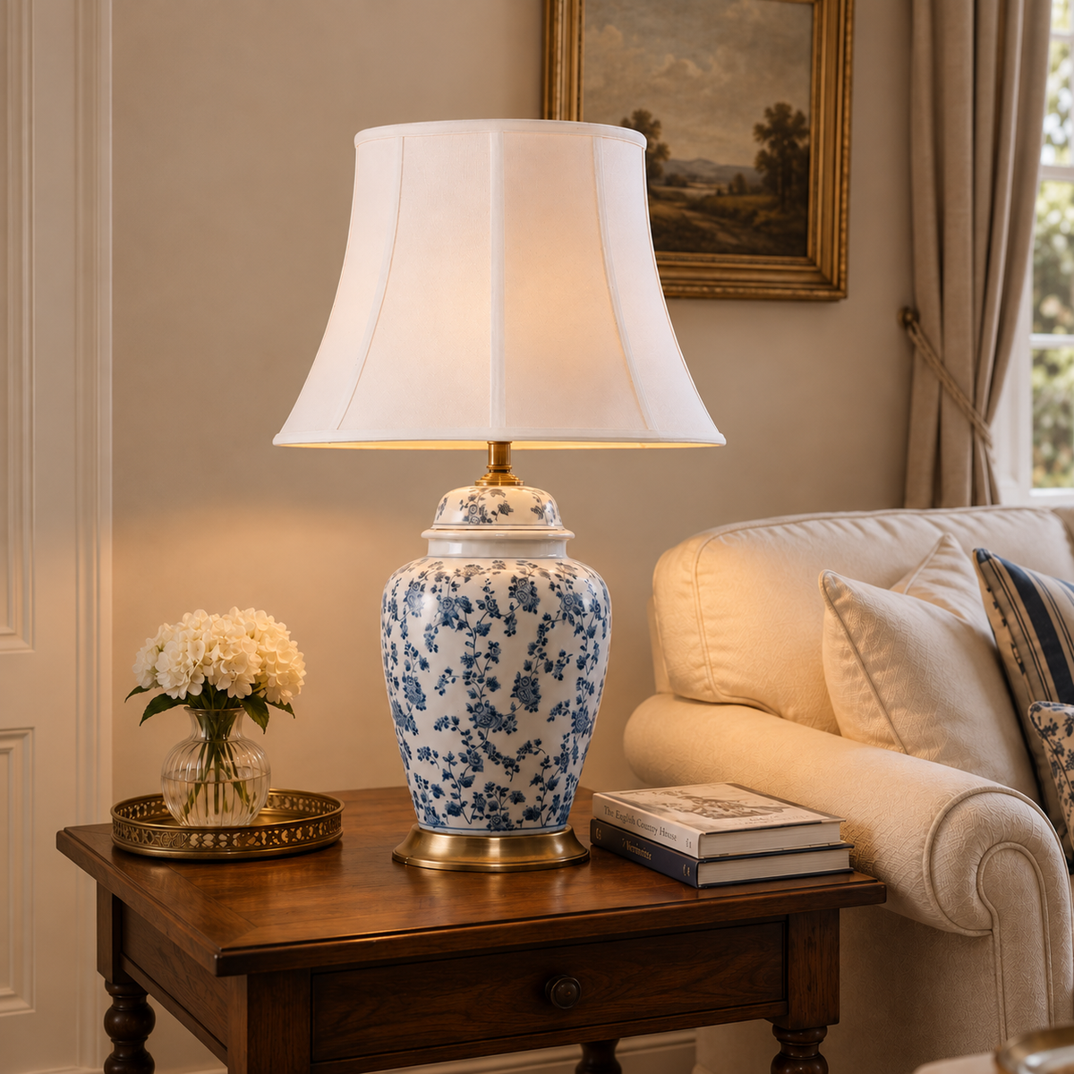 blue floral ceramic table lamp with fabric shade on a wooden living room table